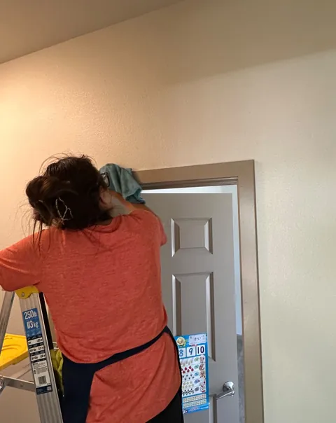 Detail cleaning around a door frame
