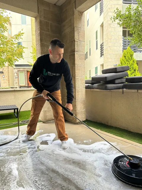 Pressure washing a covered patio