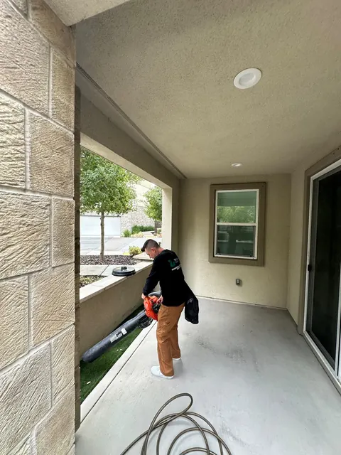 Clearing a covered patio with a blower