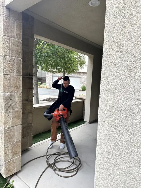 Clearing a covered patio with a blower
