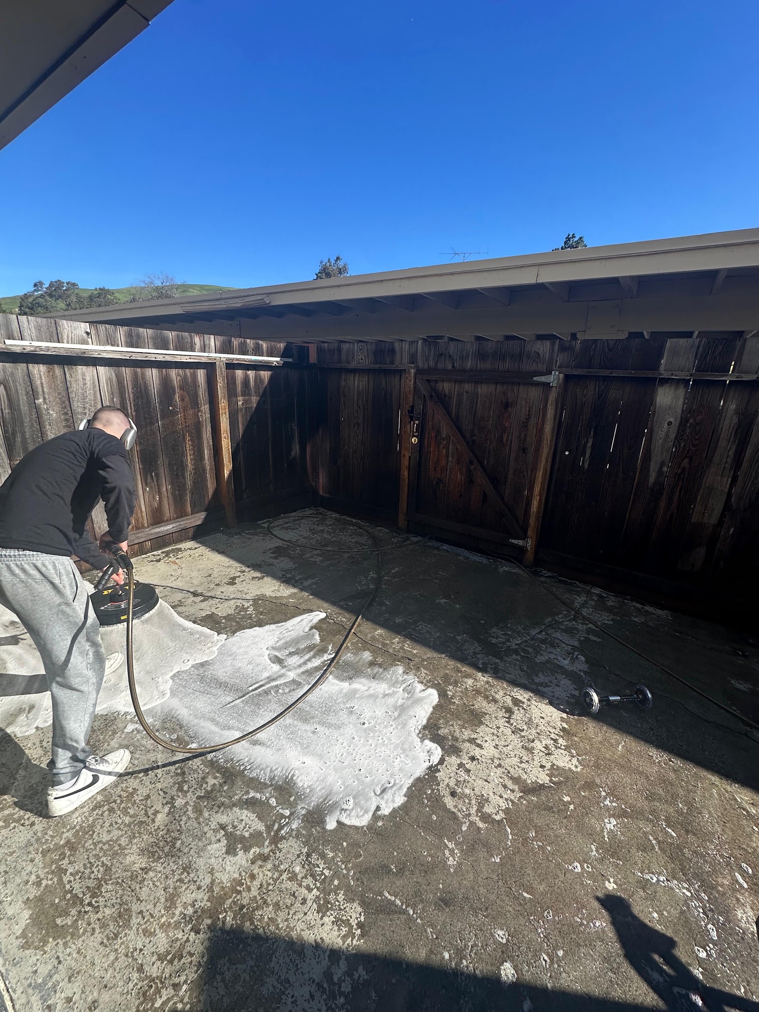Pressure washing a backyard patio in the Tri-Valley