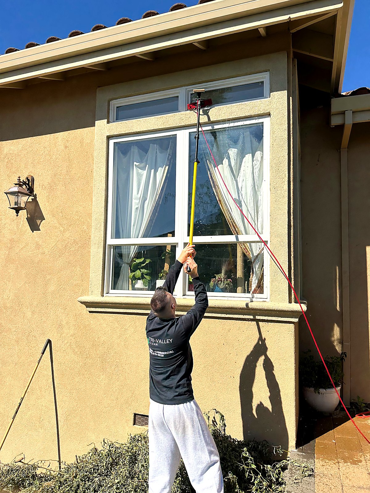Window cleaning on a two-story home